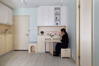 The dining area unfolds from a cabinet. 