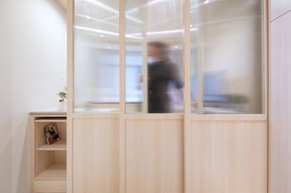 Sliding fritted glass doors provide privacy and sectioned-off spaces when needed. 