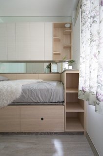 Situated above the bed is a catwalk and cubby with steps. 