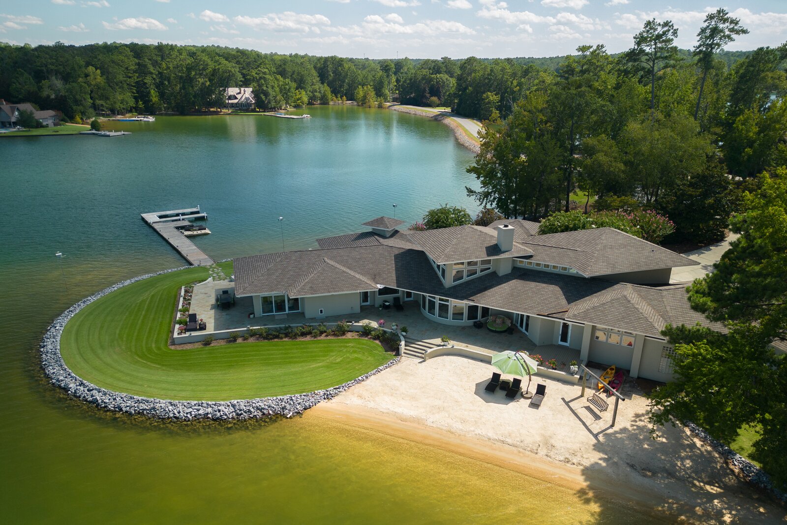 This Eclectic Lake Martin Home Comes With a Private Island and White