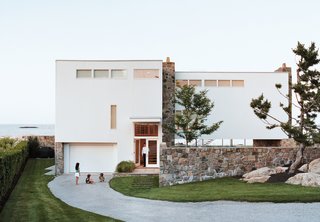 Design Icon: 10 Buildings by Marcel Breuer - Photo 3 of 11 - When this minimalist, L-shaped modern structure was first erected on the Massachusetts coastline, neighbors said it "looked like the ladies’ wing at Alcatraz," according to the original resident, John Hagerty. Decades later, guests are still stopping by to explore this inspired Gropius/Breuer collaboration. Exposed pipes and steel staircases provide a streamlined look, while towering glass windows magnify the grandeur of the churning Atlantic Ocean below. Dwell spoke with the current owner, who said the compact-yet-open floor plan results in a "liberating" living experience. 