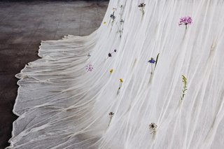 An ever-changing living vertical divider, the Draped Flowers Curtain contains over 100 pockets where fresh flowers can be placed, transforming the space it inhabits by offering a landscape of seasonality and personal contexts. 