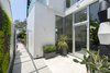Modern home with Outdoor, Raised Planters, Shrubs, Hardscapes, Side Yard, and Pavers Patio, Porch, Deck. Entry Photo 4 of 4016 Tivoli