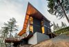 Modern home with Exterior, Wood Siding Material, House Building Type, Brick Siding Material, and Butterfly RoofLine. Back Photo 3 of The Greenhills House