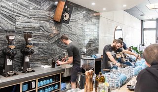The 30-foot cement-and-maple bar is the focal point of the space. Perched there, diners are treated to a bird's-eye view of Proud Mary’s exquisite coffee program. 