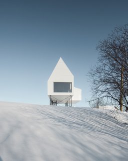 A Minimalist Winter Chalet Stands Tall on Stilts - Photo 1 of 6 -
