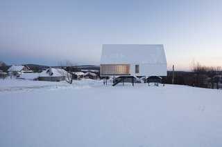 A Minimalist Winter Chalet Stands Tall on Stilts - Photo 2 of 6 -