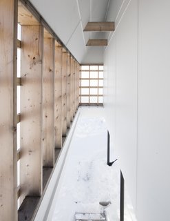 A Minimalist Winter Chalet Stands Tall on Stilts - Photo 3 of 6 -