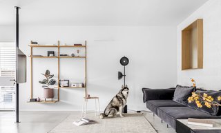Moving into a smaller home forced designer Eilat Dar to evaluate what was necessary. Adopting a minimalist aesthetic, the M Apartment makes use of every inch of space.