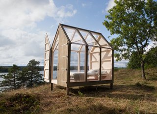 With large glass panes covering the cabin's walls and gabled roof, the changing light outdoors encourages guests to sync their sleep schedules with the sun.