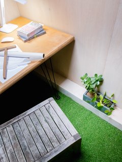 The interior includes two back-to-back desks.