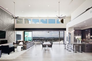 8 Things to Consider When Choosing Retractable Glass Walls - Photo 1 of 15 - Glass walls open this living room up to the outdoors.
