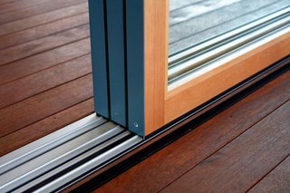 8 Things to Consider When Choosing Retractable Glass Walls - Photo 7 of 15 - Weather-resistant thresholds are best for glass walls used as unprotected exterior doors.