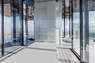 Go Stargazing in This Off-Grid Glass Prefab Nestled in the Desert - Photo 6 of 13 - Here's a look at the central core from the bedroom, which houses storage.