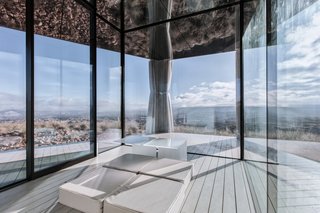 Go Stargazing in This Off-Grid Glass Prefab Nestled in the Desert - Photo 8 of 13 - Curtains can be pulled along an integrated track for greater privacy or shade.