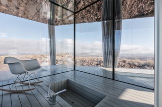 Go Stargazing in This Off-Grid Glass Prefab Nestled in the Desert - Photo 5 of 13 - The sunken bathtub overlooks stellar panoramic views.