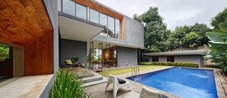 The Inside Outside house is a luxe family home that eschews a hermetic air-conditioned environment in favor of one that embraces nature and cross-breezes from all angles.