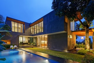 The decades-old mango tree informed the arrangement of the home.
