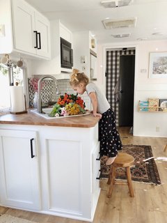 A Couple Spend $3K to Turn an Old RV Into a Cozy Home For Five - Photo 9 of 10 - The countertop is a repurposed IKEA desktop cut to size.