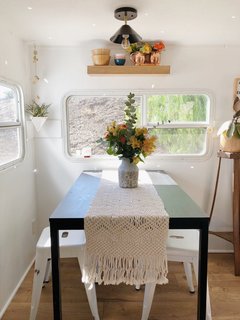 A Couple Spend $3K to Turn an Old RV Into a Cozy Home For Five - Photo 8 of 10 - The couple incorporated lighting fixtures from Lucent Lightshop throughout the space.