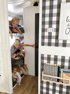 A Couple Spend $3K to Turn an Old RV Into a Cozy Home For Five - Photo 6 of 10 - Their three young children sleep in triple bunk beds in the opposite end of the RV.