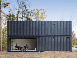 A Shipping Container Prefab Lab Is Built in Only 4 Hours - Photo 10 of 12 - The main room opens to the quad through a large pivoting garage door.