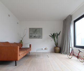 An Architect Creates a Two-Level Houseboat For His Family on a Tight Budget - Photo 4 of 10 - The expansive windows allow natural light to be infused into the house, while also creating a strong indoor/outdoor connection.