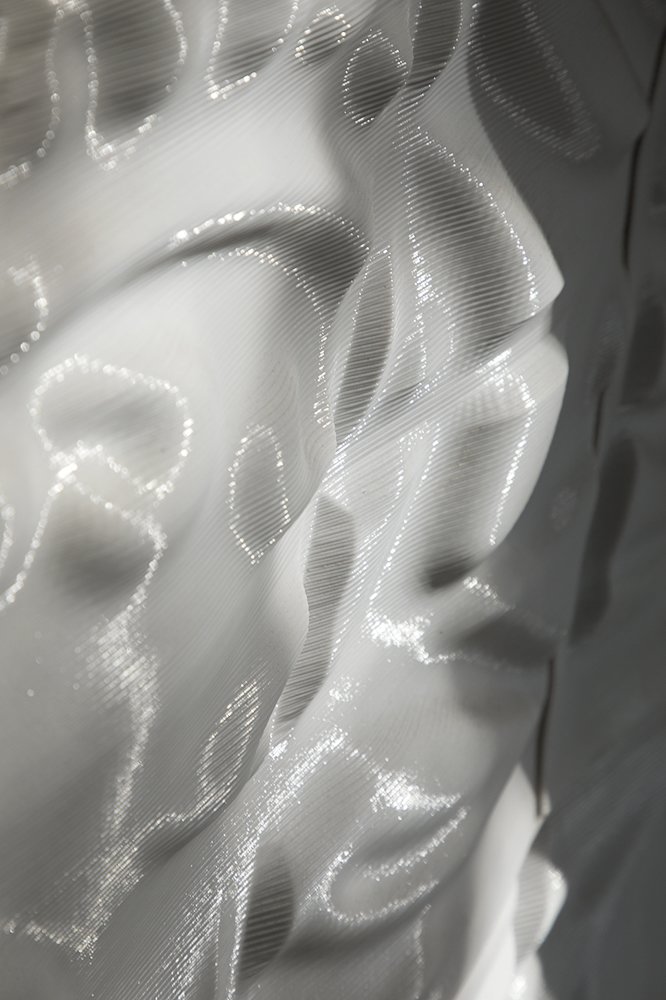 A close up of the bioplastic-based Chroma Curl wall tiles.
