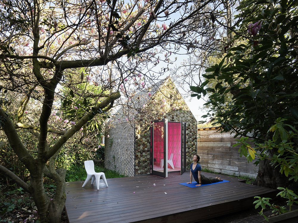 Over 4,500 3D-printed ceramic tiles clad the 120-square-foot backyard building’s wooden balloon frame.