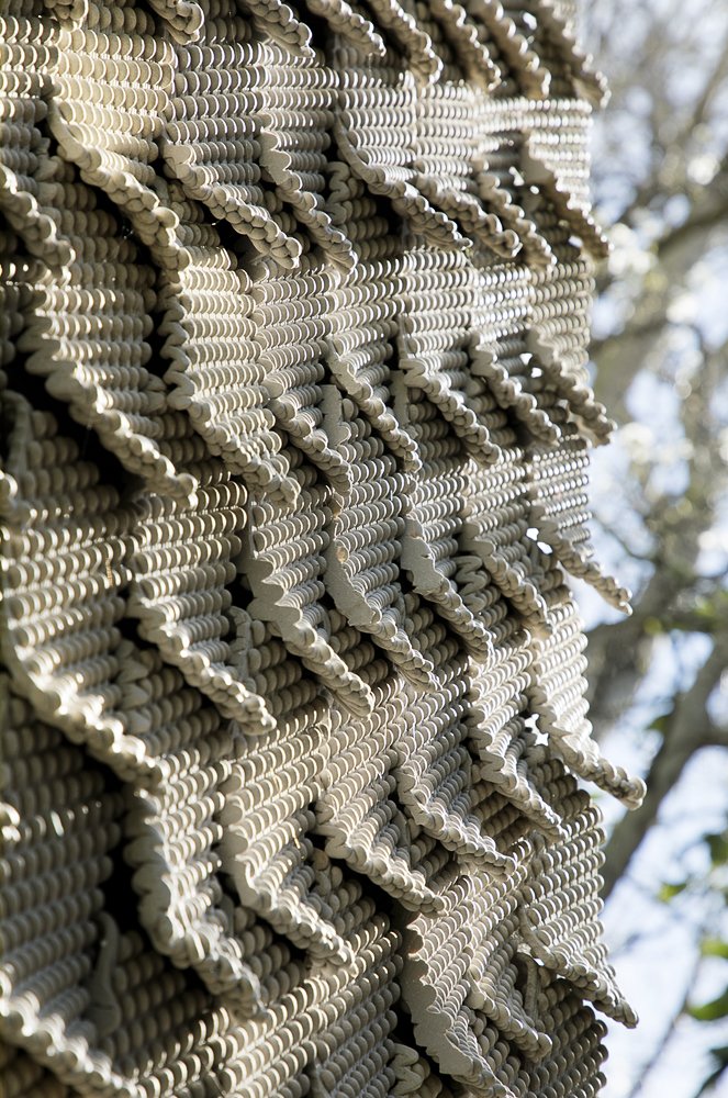 The ceramic tiles are made using customized G-code to control the printing of each line of clay.