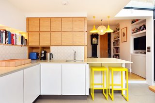 The bright Torch S3 cone pendant lights and Seleri bar stools reinforce the black-and-yellow color palette, inspired by a legendary nightclub in Manchester.