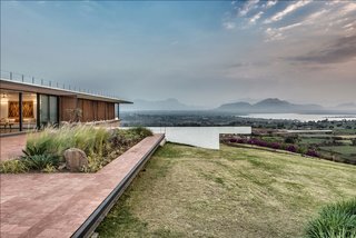 The home is set on the top of a hill for prime views.