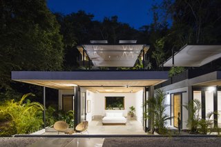 Folding glazed doors open each bedroom up to the outdoors.