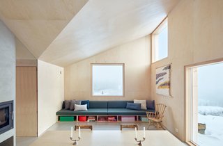 From the dining table to the bed frames, custom plywood furniture is installed throughout the home and combined with a few nature-inspired touches, like the green Kvadrat wool felt in the upholstered built-ins.