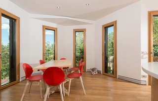 Operable glazed openings bring in natural light and ventilation to keep energy demands low.