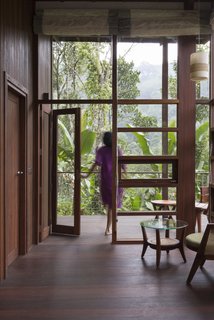 Floor-to-ceiling wood-framed glazing allows breathtaking views of the outdoors.