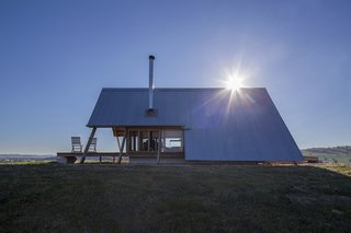 A lightweight, corrugated zinc roof clads the exterior.