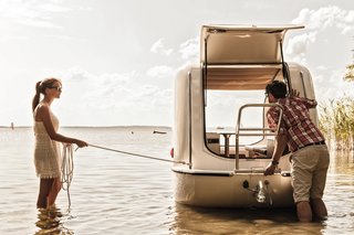 The stainless steel ladder doubles as a helpful staircase for entering the chassis on land, as well as a railing in water.