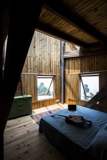 The Wood House sleeps up to 10 guests with five beds and five-and-a-half baths.