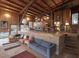 Level changes delineate programming in the interior without the need for walls, which would otherwise block natural light and views.