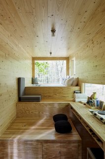 The cabins—all designed in-house—sport a minimalist aesthetic, deliberately pared-down to let nature take the spotlight. 