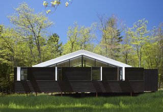 The three-bedroom home's gabled roof mimics the shape of a tent.