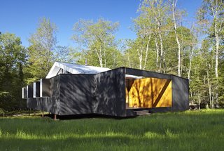 The exterior is coated in Sherwin Williams Solid Wood stain.