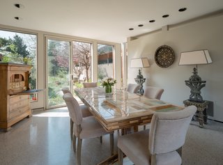 Sliding glass doors fill the dining room with abundant natural light.