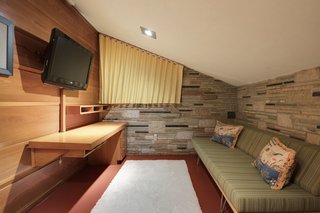 Shellacked and Western larch boards clad the interior non-bearing walls.
