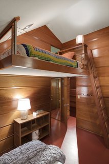 Wright designed the built-in furniture, including the banquettes, desks, tables, and beds.