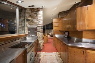 The concrete slab floor is integrated with radiant floor-heating technology throughout.