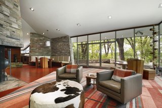 A 17-foot-tall vaulted ceiling delivers drama to the open-plan dining room and living room.