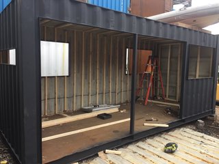 "Contanium is based in Red Hook, Brooklyn, so I could ride my bike down to the yard and meet with Mike O'Toole (owner/engineer) to talk about the design and watch the build progress," explains Porter of the process. "Within the first few days of the build, I couldn't recognize the container. It magically transformed into a small cabin."