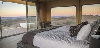 Guests wake up to views overlooking undulating hills and ridges.